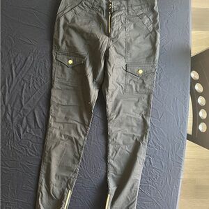 Jaanuu black scrub pants with gold colored zipper hardware cargo-extra small